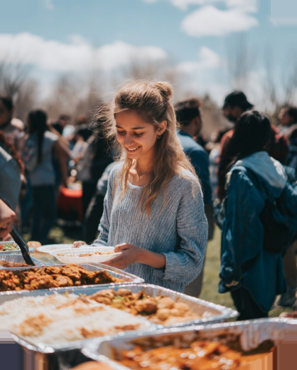 Guest serving themselves at an outdoor catered event
